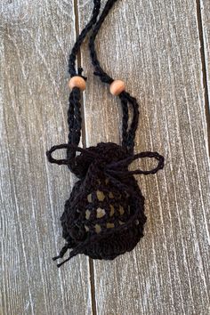 "We are excited to introduce our new collection of mini crochet crystal pouch necklaces with this beautiful black version, holding a rough Golden Yellow Topaz. The drawstring opening makes it easy to swap crystals, so that you can always carry your daily favorites. . The pouch is about 2.25\" long and 1.75\" wide. You can choose between a regular string and a gold plated chain. (Other chains are available on request.) The regular string is adjustable in length with sliding beads. The crystal pou Black Bohemian Necklace For Everyday Use, Black Bohemian Necklace For Everyday, Handmade Black Crochet Bag For Gift, Handmade Black Crochet Bag As Gift, Handmade Black Crochet Bag As A Gift, Black Handmade Crochet Bag For Gift, Handmade Black Jewelry For Personal Use, Handmade Black Crochet Pouch Bag, Black Crochet Bags As Gift