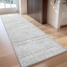 a large white rug in the middle of a room