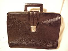 Vintage 1980's black leather legal/business bag - hand briefcase - travel bag.Made in GERMANY. Measurements: H - 13'' [ 33cm.] W - 17 1/3'' [ 44cm.] Side - 5'' [ 13cm.] One section inside. Made in GERMANY / marking the lock/ Missing key. Used.Good vintage condition. NOTE: All vintage items in my shop that are used have been restored according to the possibilities All defects are removed,except the normal signs of use over the years. Thank you and successful shopping. Vintage Black Briefcase For Office, Retro Formal Satchel Briefcase, Vintage Black Briefcase For Formal Use, Retro Rectangular Business Briefcase, Retro Rectangular Briefcase For Business, Retro Leather Briefcase For Formal Use, Vintage Black Rectangular Briefcase, Vintage Rectangular Black Briefcase, Vintage Formal Briefcase With Luggage Sleeve