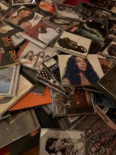 a pile of various records and cds on top of each other