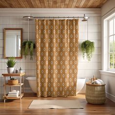 a bath room with a shower curtain and a rug on the floor in front of it