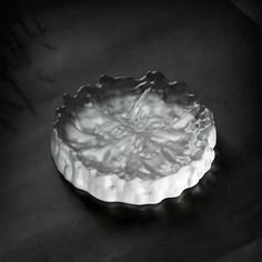 a white bowl sitting on top of a table