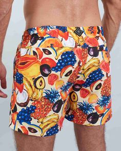 Sport a stylish look with these swim shorts, featuring a unique tutti frutti design. Benefits: Fashionable and environmentally responsible, made from recycled materials. Quick-drying fabric for superior comfort and convenience. Perfect for beach days or lounging by the pool. Practical design includes a hidden pocket and a "wet bag" for essentials. We donate 10% of all swim shorts sales to SANCCOB, supporting the rescue and rehabilitation of African penguins and seabirds. Multicolor Swimwear With Built-in Shorts For Vacation, Orange Swim Trunks With Built-in Shorts For Beach, Playful Shorts For Summer Poolside, Multicolor Swim Trunks With Built-in Shorts For Beach Party, Playful Short Swim Trunks For Summer, Orange Beachwear Swimwear With Built-in Shorts, Multicolor Hawaiian Style Shorts, Multicolor Short Swim Trunks For Beach Party, Yellow Swim Trunks For Summer Beach