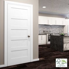 an open door leading to a kitchen with white cabinets and counter tops in the background