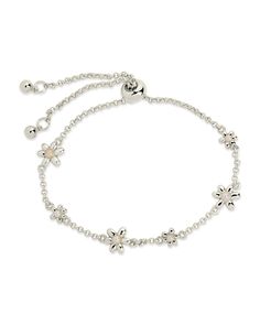 Elevate your wristwear game with the Vallie Bolo Bracelet. Adorned with lustrous pearls and delicate flower pendants, this adjustable bracelet adds a touch of elegance to any outfit. A must-have for the sophisticated and exclusive fashion connoisseur. Materials: 14K gold or rhodium plated brass, shell pearls Features: Measures 9" length, 0.35" & 0.45" charms, 1.5mm chain, 2mm & 2.5mm pearls, Lead & Nickel free, bolo/sliding knot- one size fits most Delicate Adjustable Jubilee Chain Bracelet, Feminine Adjustable White Jewelry, Feminine White Adjustable Jewelry, Elegant Beaded Bracelets With Flower Charm As Gift, Elegant Adjustable Bracelets, Adjustable Metal Pearl Bracelet With Jubilee Details, Elegant Metal Chain Bracelet With Adjustable Length, Formal Charm Bracelet With Adjustable Chain, Delicate Beaded Bracelet With Adjustable Chain