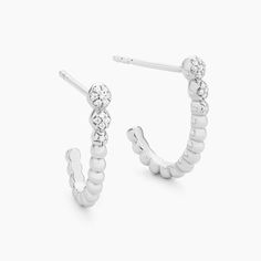 SKU# E-10933 Diamond Weight 0.03cts Earrings Height 16.40 mm Width 3.30 mm Thickness 2.60 mm. Post back closure Finish 14k gold plated sterling silver or in sterling silver. Avoid contact with anything containing derivatives of alcohol.