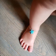 Love My Little Model? This Silver Color Alloy Bracelet (1.5mm Chain) Featuring A Blue Porcelain Starfish Is Adjustable (6" - 6 1/2") Via Chain At The End. I Can Also Alter The Length Upon Request. Very Cute And Dainty For The Summer. Obviously It Can Be An Ankle Bracelet For Your Little One! Handmade Blue Star-shaped Bracelet, Handmade Blue Star Bracelet, Adjustable Blue Jewelry With Starfish Charm, Adjustable Blue Starfish Jewelry, Adjustable Turquoise Jewelry With Star Charm, Blue Star Charm Bracelet, Blue Bracelet With Star Charm As Gift, Turquoise Bracelet With Starfish Charm As Gift, Blue Bracelets With Star Charm For Gift