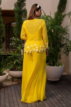 Yellow appliqued floral tunic with pearl embroidery. Paired with a padded inner bustier and matching flared palazzo. - Aza Fashions V-neck Wedding Sets With Floral Embroidery, Spring Chikankari Embroidery V-neck Set, Spring V-neck Chikankari Embroidered Sets, Designer V-neck Set With Intricate Embroidery, Embellished Georgette V-neck Set, Embellished V-neck Georgette Sets, Spring Designer V-neck Dress, Elegant Embroidered V-neck Palazzo Set, Spring V-neck Sets With Resham Embroidery