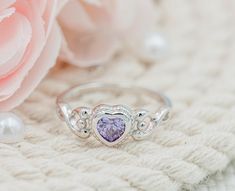 Precious sterling silver birthstone ring for children with a heart-shaped Amethyst CZ stone or February birthstone. These are high-quality rings with rhodium plating to prevent tarnish for little girls, toddlers, kids, and children. The are great pinky rings as well. This comes in a black velvet heart ring box and is available in sizes 1-5. Ring Sizing: https://cherishedmomentsshop.com/pages/sizing-charts Silver Heart-shaped Birthstone Ring Gift, Silver Amethyst Ring For Valentine's Day Gift, Silver Cubic Zirconia Birthstone Ring For Valentine's Day, Silver Heart Birthstone Ring For Mother's Day, Heart Shaped Silver Birthstone Ring For Mother's Day, Silver Heart-shaped Birthstone Ring For Mother's Day, Silver Heart Ring For May Birthstone Gift, Heart Cut Birthstone Rings For Birthday, Heart Cut Birthstone Rings For Birthdays