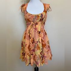 Brand New With Tags $128 Retail Free People Movement Floral Print Smocked Bodice Mini Dress In Orange Womens Size Xs Pit To Pit 15” Length 31” Please See All Photos For More Details And Measurements Fitted Multicolor Smocked Beach Dress, Fitted Multicolor Smocked Dress For Beach, Fitted Multicolor Smocked Dress For The Beach, Yellow Smocked Bodice Flowy Dress, Yellow Flowy Dress With Smocked Bodice, Bohemian Ruched Mini Dress For The Beach, Fitted Multicolor Smocked Dress For Vacation, Flowy Yellow Dress With Smocked Bodice, Multicolor Ruched Smocked Summer Dress