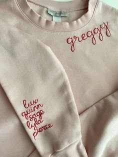 Grandma's favorite names hand stitched on the sleeve of our cozy fleece lined sweatshirts.    Sweatshirts are Unisex sizing and run true to size.  I suggest sizing up for a more oversized fit. 70/30 cotton/polyester 3-End fleece, ring spun cotton  Returns and Exchanges: I do not accept returns on personalized pieces but will be happy to discuss any issues via messages. Thanks for visiting Sweet Olive Street! Please check us out on Instagram for more behind the scenes @sweetolivestreet Cozy Long Sleeve Tops With Letter Embroidery, Pink Crew Sweatshirt With Embroidered Graphics, Cozy Embroidered Long Sleeve Sweatshirt, Cozy Long Sleeve Sweatshirt With Letter Embroidery, Cozy Long Sleeve Sweatshirt With Embroidered Logo, Pink Winter Sweatshirt With Embroidered Graphics, Winter Pink Sweatshirt With Embroidered Graphics, Long Sleeve Fleece Top With Letter Embroidery, Fleece Top With Letter Embroidery And Long Sleeves