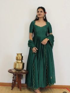 Hand embroidered Anarkali with hand embroidered / anarkali suit set / hand embroidery anarkali gown USA / green designer wedding dress with embroidery / Indian dresses/ voggish / green pure silk  dress         Looking for a perfect indian dress/anarkali/suit sets that are trendy, unique and easy to carry !! yess, You are at the right place. we carry such versatile pieces of anarkalis and suit sets that really let you stand out in any occassion !!      featuring this beautiful anarkali dress in dark green color with simple hand embroidery at the front body part with elbow sleeves as shown made with pure chanderi with heavy gear as shown paired with matching scallop embroidered Kota dupatta !! A very classy, beautiful look makes your occasion Perfect !! Ready to ship !!  Details :  - color : Dark Green Anarkali Dress, Simple Anarkali Suits Classy, Heavy Anarkali Dress, Dark Green Anarkali, Anarkali Suits Designer Latest, Wedding Anarkali Dress, Simple Anarkali Suits, Hand Work Dress, Green Anarkali Dress