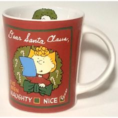 a red coffee mug with a cartoon character on the front and bottom, says san santa claus