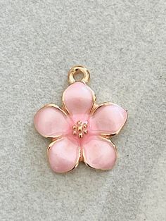 3 dainty pink enamel and gold tone flower charms - pearlized design shiny petals - gold centerListing is for 3 charmsShiny pink enamel flowers Gold tonePearlized shiny petals Daisy flowerNature Flower charmsBouquet Bracelet- necklace - pendant Children’s jewelryPerfect for all your DIY creations Measurement 17mm x 15mm***Although I try hard to represent actual colors, color may vary due to lighting depicted on computer monitors and mobile devices.*** Pink Enamel Flower-shaped Jewelry, Pink Enamel Jewelry With Flower Charm, Delicate Pink Flower Charm Jewelry, Delicate Pink Jewelry With Flower Charm, Pink Enamel Charms For Gifts, Pink Enamel Dainty Jewelry, Pink Enamel Charms Jewelry, Pink Enamel Jewelry With Charms, Pink Flower Pendant Jewelry With Charms