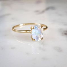 Moonstone Engagement Ring - Moonstone Wedding Set, Delicate Moonstone Ring, Solitaire, June Birthstone, Rainbow Moonstone, Blue Moon Romantic and timeless, contemporary yet feminine. A beautiful faceted moonstone glows blue within our delicate 4 prong setting. Super clean and stunning. Delicate Oval Moonstone Ring In 14k Gold, Minimalist Oval Moonstone Birthstone Ring, Oval Solitaire Moonstone Ring In 14k Gold, Oval White Moonstone Ring In 14k Gold, White Moonstone Ring In 14k Gold, Oval Shaped, Delicate Oval Gemstone Birthstone Ring, Delicate Oval Birthstone Ring, Minimalist Oval Moonstone Ring, Dainty Oval Moonstone Rings