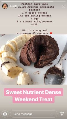 there is a chocolate cake on the plate with banana slices and spoons next to it