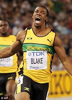 a man running in a race with his mouth open