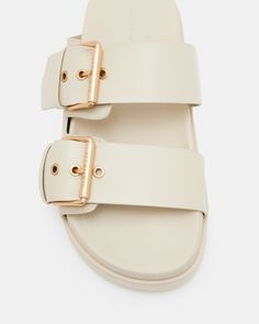 Warmer days are here - the Sian Sandals are perfect for city strolls. Featuring a thick sole with two chunky straps and matte black buckles. Our signature is on the side, it's a subtle addition.      Flats Two straps Slip on Buckle detail Matte black hardware AllSaints 01-11-94 branding If you are between sizes, we recommend sizing up Modern Flat Footbed Sandals With Buckle Closure, Casual Leather Slides With Tang Buckle, Casual Leather Footbed Sandals With Tang Buckle, Flat Sandals With Buckle Closure For Everyday, Modern Double Strap Footbed Sandals With Buckle Closure, Everyday Flat Heel Sandals With Buckle Closure, Everyday Flat Leather Footbed Sandals, Everyday Sandals With Buckle Closure And Flat Heel, Everyday Double Strap Sandals With Buckle