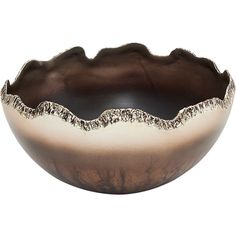 a brown and white bowl sitting on top of a table