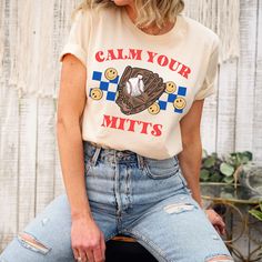 This retro Calm Your Mitts shirt is perfect for the baseball season! This makes a fun baseball fan shirt to wear all year. T-shirts make great gifts for baseball moms! This t-shirt is everything you've dreamed of and more. It feels soft and lightweight, with the right amount of stretch. It's comfortable and flattering for all.  Show off your personality with our fun and unique designs!   ** P R O D U C T   D E T A I L S **  - High Quality, Super Soft and Comfy Bella + Canvas T-Shirt  - 100 % Pre-Shrunk Cotton  (heather colors are polycotton blend)  - Direct to Garment print (no stencils or vinyl which means it will last a lot longer)   - Printed and Shipped in the USA  - Due to different monitor screens colors may vary ** S I Z I N G **  - Consult size chart in listings for measurements  - Casual Baseball Jersey For Fans, Cotton Baseball Jersey With Short Sleeves For Fans, Cotton Sports Fan Baseball Jersey, Cotton Short Sleeve Baseball Jersey For Fans, Team Spirit Cotton Baseball Jersey For Baseball Season, Cotton Baseball Jersey For Team Spirit, Cotton Baseball Team Jersey, Game Day Baseball Jersey With Graphic Print, Varsity Cotton Baseball Jersey For Fans