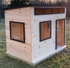 a small house made out of wood and windows