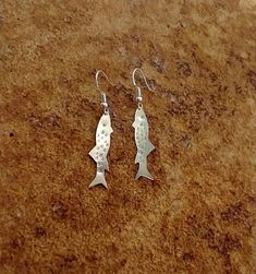 "Trout earrings, sterling silver.  I've volunteered with various fish conservation groups over the years and I love my local trout!  I love helping laws get passed to keep the rivers clean.  And yes, I love to catch and eat them too. The fish themselves are 1.25\" long in this photograph.  However, you have the option to choose the smaller 1\" fish." Trout Earrings, Leaf Earrings Silver, Silver Wire Rings, Fish Earrings, Fish Jewelry, Fish Necklace, Silver Fish, Gold Moon, Onyx Bead