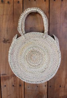 Lightweight Bag. Large Bag. Hand died palm leaf. Round Handel. Beach Bag. TASSEL SOLD SEPARATELY Diameter- 10 inches Height including handals- 15 inches Bohemian Natural Beach Bag For Spring, Bohemian Beach Bag For Spring, Spring Bohemian Beach Bag, Bohemian Handwoven Beach Bag For Festivals, Bohemian Beach Bag With Braided Handles, Bohemian Spring Beach Bag For Daily Use, Bohemian Spring Handwoven Beach Bag, Handwoven Bohemian Bags For Spring, Bohemian Straw Bag With Braided Handles For Festival