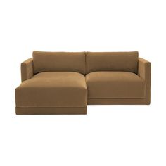 a brown couch sitting on top of a white floor