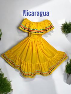 Handmade Nicaragua Traditional Dress - Yellow, we have your size. Celebrate the wonderful Colombian culture. Wear your dress and be part of a beautiful tradition. Includes: Blouse and SkirtSizes: X small to XX Large - Length: 36in Approx. Note: Check the Photo Gallery to access the Size Chart Color: White and blue Material: PolyCottonHow should I care for and clean the dress: Hand-Wash or Dry-CleanMake every day special with our Nicaragua Traditional Dress - Yellow. Perfect, made just how you li Nicaragua Traditional Dress, Nicaragua Culture, Folklorico Dresses, Colombian Culture, Dress Yellow, Traditional Dress, I Care, Nicaragua, Yellow Dress