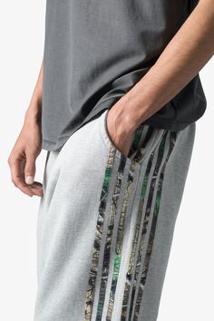 the Hunter Camo Stripe Sweatpants are designed with a relaxed fit throughout, featuring an elasticized self waist, tonal cotton drawstrings, standard hem at the leg opening, hunter camo patterned stripes at the outseam, and finished with a vintage wash. details relaxed fit 100% cotton model is 6’1, 140 lbs and wears a size medium Camouflage Cotton Joggers With Pockets, Cotton Joggers With Three Stripes In Relaxed Fit, Cotton Joggers With Side Stripes And Relaxed Fit, Camouflage Cotton Bottoms With Elastic Waistband, Camouflage Relaxed Fit Bottoms With Elastic Waistband, Relaxed Fit Cotton Sweatpants With Three Stripes, Cotton Pants With Three Stripes And Relaxed Fit, Casual Camouflage Cotton Sweatpants, Camouflage Cotton Sweatpants For Streetwear