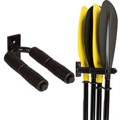 two black and yellow surfboards are attached to the back of a rack with three poles