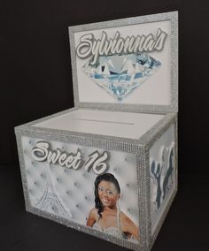 the box is decorated with an image of a woman's face and diamond on it