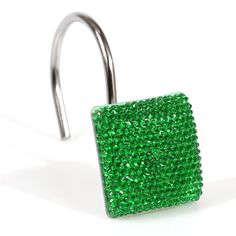 a pair of green jeweled surgical steel barbells with an invisible crystal cover