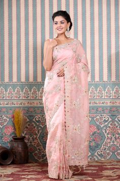 Beautiful light pink embroidered organza saree is a perfect drape for festive occasions! It comes with a matching blouse piece. Disclaimer: The actual product may vary slightly from the image. These are custom orders, hence expect slight variation in color, placement of the motif or buta. ESTIMATED DELIVERYBecause this is a custom order, it would take about 4 weeks from the date of purchase. RETURN POLICYThis product is a custom order and cannot be returned or exchanged. Organza Sari, Wedding Sarees, Embroidered Organza, Fashion Journals, Traditional Fabric, Organza Saree, Designer Sarees, Handloom Saree, Beautiful Lights