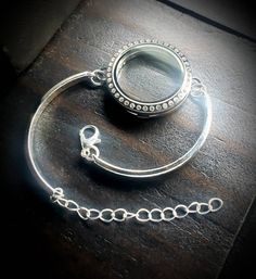 What you will receive: 1-Large (30mm) Silver Stainless Steel Floating Locket Bar Bracelet with a Crystal Magnetic Face One Size fits all (adjustable bracelet chain included) You can check out my pre-designed floating locket combinations here: https://www.etsy.com/shop/PrettyPalazzo?section_id=15744730&ref=shopsection_leftnav_4 Shipping: Orders are shipped out within 1-2 business days. Most orders can be shipped out the same day if they are ordered before 3pm Eastern Time. Great care is taken Adjustable Silver Stainless Steel Bracelets, Stainless Steel Jewelry With Silver Chain And Round Pendant, Personalized Silver Crystal Bracelet For Gift, Silver Crystal Bracelet Gift, Adjustable Silver Jewelry With Lobster Clasp, Silver Crystal Bracelet As Gift, Personalized Silver Crystal Bracelet For Anniversary, Silver Crystal Chain Bracelet As Gift, Silver Crystal Bangle Bracelet As Gift