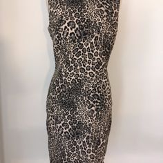 Elegant And Flattering Black And Cream Cheetah Dress With Back Exposed Zipper. Very Chic!! Length - From Top Of Shoulder To Hem - 37 1/2 Inches Bust - 38 Inches Approx. Hip - 40 Inches Approx. Fabric Content - 75% Viscose, 12 % Polyester, 10 % Nylon And 3% Spandex Care - Dry Clean Only Sleeveless Stretch Mini Dress In Leopard Print, Sleeveless Stretch Leopard Print Mini Dress, Sleeveless Stretch Leopard Print Bodycon Dress, Stretch Sleeveless Leopard Print Bodycon Dress, Chic Sleeveless Leopard Print Dress, Stretch Leopard Print Sleeveless Bodycon Dress, Stretch Leopard Print Sleeveless Mini Dress, Chic Leopard Print Sleeveless Dress, Fitted Sleeveless Mini Dress In Leopard Print