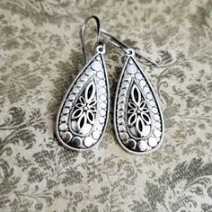 "Silver Filigree Teardrop Earrings Just got in! These teardrops are amazing in their elegant simplicity!! Gorgeous silver work. I hung simply on either solid surgical steel leverback wires, artisan antiqued silver french hooks or surgical steel fish hooks. REPEAT CUSTOMERS: Don't forget to use your special discount. GIFT WRAPPING/PACKAGING All Magpies are handmade by me and will arrive charmingly gift wrapped in a rustic gift box tied with a raffia ribbon, ready for giving or your personal pleas Ornate Nickel-free Teardrop Dangle Earrings, Ornate Teardrop Chandelier Earrings Nickel Free, Ornate Teardrop Nickel-free Chandelier Earrings, Ornate Teardrop Earrings As Gift, Handmade Ornate Teardrop Earrings, Classic Teardrop Earrings With Intricate Design, Ornate Sterling Silver Teardrop Earrings, Metal Teardrop Earrings For Wedding, Ornate Dangle Teardrop Earrings