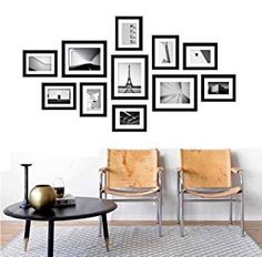 a living room with chairs and pictures on the wall