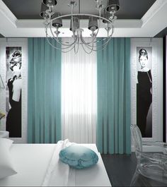 a bedroom decorated in black and white with blue accents