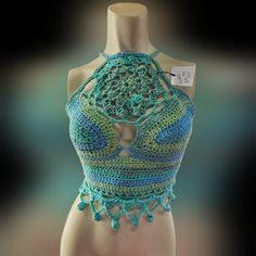 A Crocheted Handmade Mandala Designed Teal Green Crop Top. Perfect For Summer! All Purchases Support Future Art And My Family. Handmade Blue Bohemian Tops, Handmade Bohemian Blue Tops, Handmade Blue Tops For Festival, Fitted Turquoise Bohemian Tops, Fitted Bohemian Turquoise Tops, Blue Crochet Crop Top For Festival, Festival Crochet Blue Crop Top, Blue Crochet Tops For Vacation, Blue Crochet Lace Top For Vacation