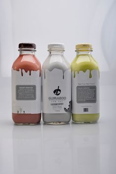 three different types of juices sitting next to each other