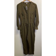 Old Navy Women's Size M Olive Green Viscose Long Sleeve Button Up Cropped Jumpsuit Old Navy Jumpsuit Olive Green 100% Viscose Cropped Long Sleeve Button Up Closure Elastic Waist With Adjustable Drawstring 2 Chest Pockets And 2 Front Side Pockets Women's Size Medium Very Good Preowned Condition With No Rips, Holes Or Stains Noted. Armpit To Armpit: 20" Inseam: 24" Long Sleeve Solid Jumpsuits And Rompers With Buttons, Solid Long Sleeve Jumpsuits And Rompers With Buttons, Solid Long-sleeve Jumpsuit With Buttons, Solid Long Sleeve Jumpsuit With Buttons, Long Sleeve Jumpsuits And Rompers With Buttons, Cotton Jumpsuits And Rompers With Buttons For Fall, Casual Jumpsuits And Rompers With Buttons For Work, Fall Utility Jumpsuits And Rompers With Buttons, Utility Style Jumpsuits And Rompers With Buttons For Fall