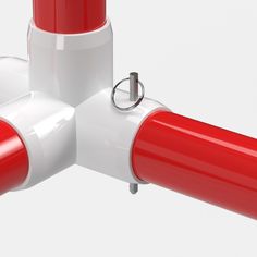 a red and white object is shown in the middle of two poles, one with a ring on each end