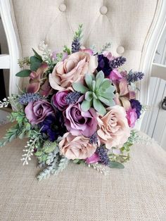 a bouquet of flowers sitting on top of a chair