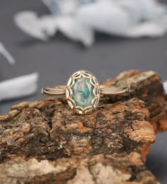 a close up of a ring on a rock