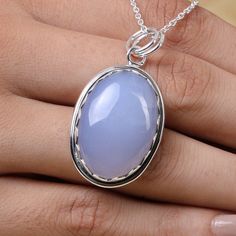 "Chalcedony Pendant, 925 Sterling Silver Pendant, Oval Pendant, Gemstone Pendant, March Birthstone Pendant, Handmade Jewelry, Boho Necklace Gemstone Name- Chalcedony Stone quality - AAA Pendant size - Height - 5 cm, Width - 2.5 cm Pendant weight - 10.92 grams Stone Shape - As shown in the picture You'll get the exact product as shown in the pictures The Height of the pendant including the loop is 5 cm 18 inch Chain - The total length of the chain is 18 inch including a 2-inch adjustable chain. S Silver Gemstone Cabochons Fine Jewelry, Fine Jewelry Silver Gemstone Cabochons, Fine Jewelry Cabochon Gemstone Pendant, Oval Chalcedony Fine Jewelry, Silver Necklace With Large Oval Cabochon Stone, Silver Jewelry With Large Round Stone, Silver Oval Cabochons Fine Jewelry, Fine Jewelry Silver Cabochons, Silver Cabochons For Gift, Fine Jewelry Style