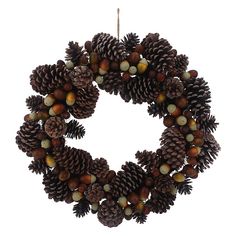 a wreath made out of pine cones and acorns