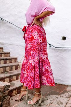 The perfect outfit completer, our gorgeous 'Kiss Me In The Meadow Maxi Skirt' features lightweight material patterned with a light pink, red, and natural hue floral print, a high waistline with a tie belt, and a relaxed silhouette that falls into a straight ankle-length hemline! Measurements XS : Hip 34", Length 35", Waist 24". S : Hip 36", Length 35.5", Waist 26". M : Hip 38", Length 35.5", Waist 28". L : Hip 40", Length 36", Waist 30". High Waist Floral Print Skirt For Summer, High Waist Floral Maxi Skirt For Summer, Spring High Waist Belted Skirt, High Waist Belted Skirt For Spring, Red Maxi Skirt With Elastic Waistband For Beach, Feminine High Waist Maxi Skirt For Spring, Feminine High-waist Maxi Skirt For Spring, Chic Red Floral Print Bottoms, Red Summer Skirt With Elastic Waistband