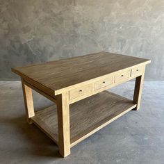 a wooden table with two drawers on one side and an open shelf on the other