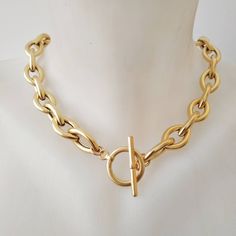 "A beautiful and unique gold plated necklace with a toggle clasp. This gold chain necklace has unique eye shaped links. Easy to match, this chunky gold  necklace will upgrade any outfit! This is a light weight necklace! links are hollow! Available in silver plating as well. Materials: 24 k gold plated brass chain and elements - matte/shiny finish  Silver plated brass chain and elements - oxidized finish Measurements: Chain width: 0.4\"/1.c\"m Clasp diameter: 0.8\"/2 c\"m Thickness: 0.12\"/3 m\"m Luxury Recycled Gold Tarnish Resistant Chain Necklace, Chunky Gold Metal Necklace, Oval Link Toggle Necklace With Gold Chain, Metal Toggle Necklace With Oval Link Gold Chain, Gold-tone Oval Link Necklace With Toggle Clasp, Yellow Gold Toggle Necklace With Chunky Link Chain, Gold Chain Link Toggle Necklace, Metal Chain Necklace With Oval Link And Toggle Clasp, Metal Chain Necklace With Toggle Clasp And Oval Link